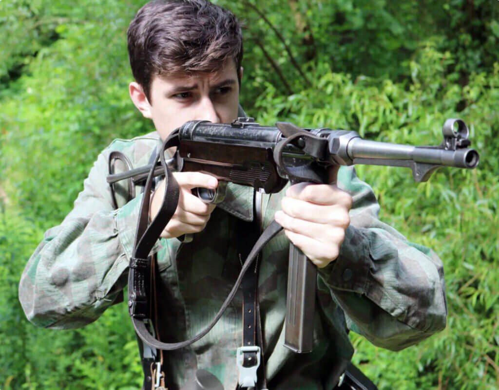 man holding an MP-40